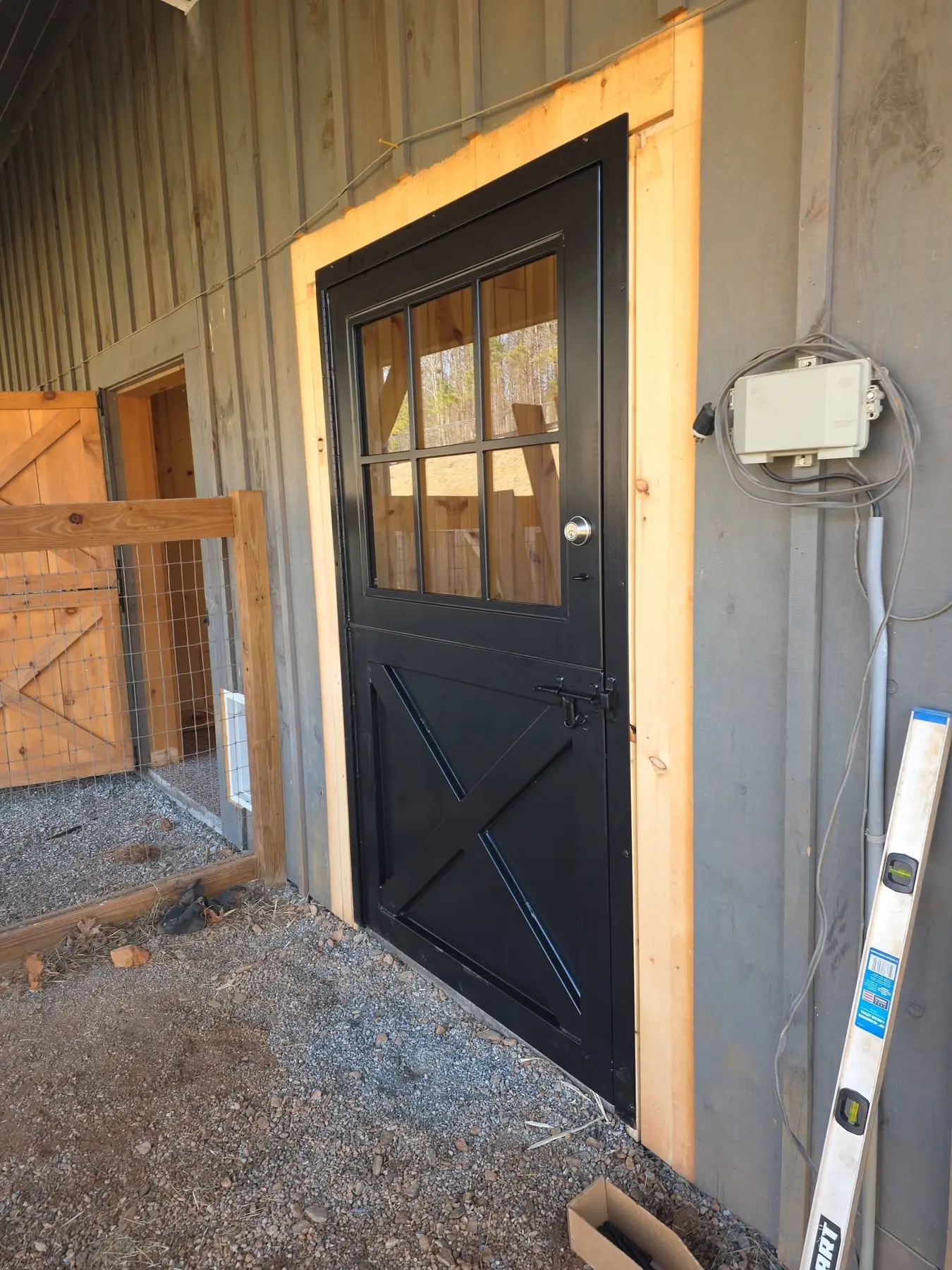 New black Dutch-style stable door viewed from the exterior