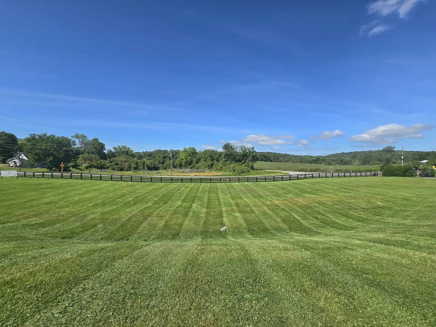Striped mowing across a large open property
